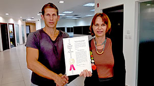 Maya Basanchik with Ran Rayter from Berale holding the certificate of a USA patent for automatic summarizing of media content